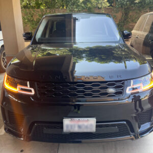 Black Range Rover with blurred-out plate number